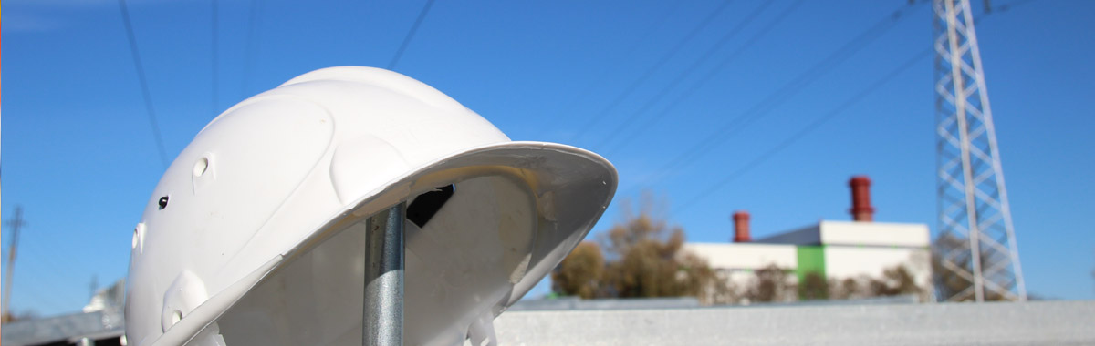 White hard hat under electrical lines